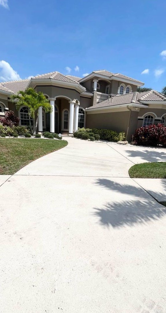 The same driveway cleaned back to a bright even finish