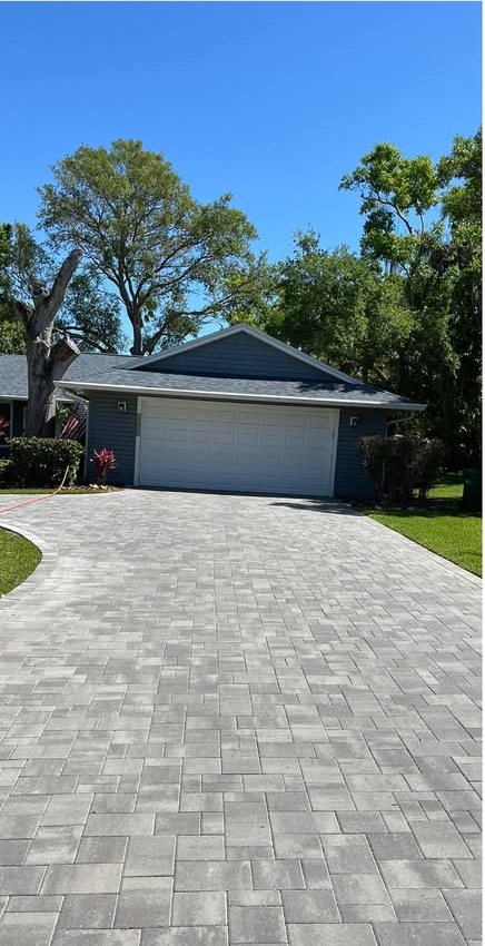 A faded paver driveway before cleaning and sealing