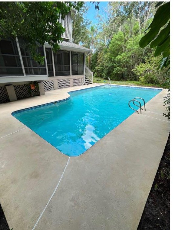 The same pool deck cleaned back to a bright, slip-safe finish