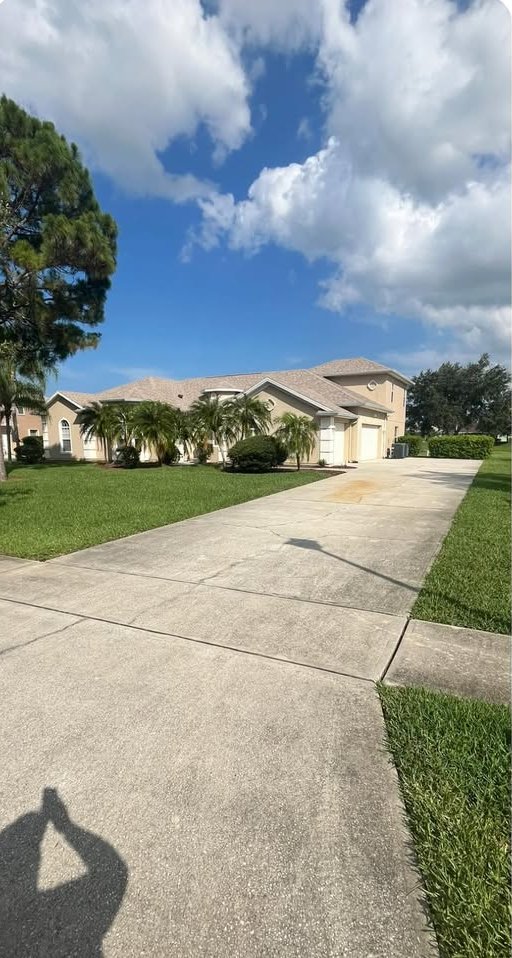 A cleaned driveway and home exterior in Rockledge, Florida